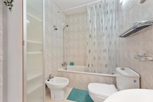 a bathroom with a toilet and a shower and a sink at Casa Donna in Playa Honda +14 photos