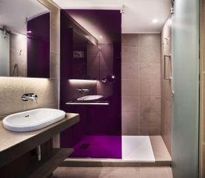 a bathroom with a sink, toilet and bathtub at Radisson Blu Hotel, Lyon in Lyon