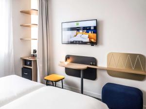 Posteľ alebo postele v izbe v ubytovaní ibis Styles Paris Romainville