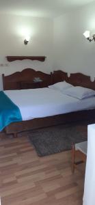 Postel nebo postele na pokoji v ubytování Hotel Cheia