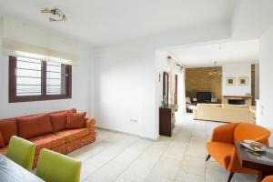 a living room with a couch and a table at #FLH-Seagrove-Beachfront Villa In Possidi in Skála Foúrkas