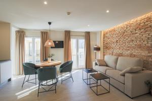 TV a/nebo společenská místnost v ubytování Apartamentos Magna Sevilla