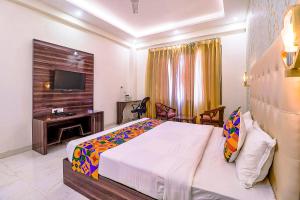 Postel nebo postele na pokoji v ubytování FabHotel Swess Grand