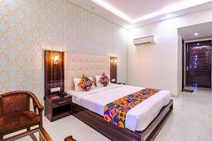 Postel nebo postele na pokoji v ubytování FabHotel Swess Grand + 23 fotografií