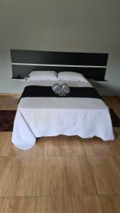 Кровать или кровати в номере Pousada Serra Mística