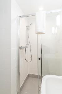 a shower with a glass door in a bathroom at The Dinton Hermit in Dinton +46 photos