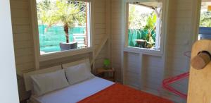 Postel nebo postele na pokoji v ubytování Mini-villa entre montagne et mer
