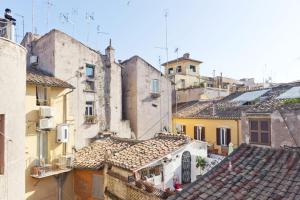 an aerial view of a city with buildings and roofs at Trastevere Heart Home in Rome