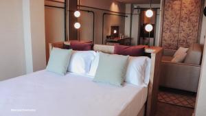 Postel nebo postele na pokoji v ubytování JovA Hotel Boutique