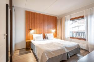 Postel nebo postele na pokoji v ubytování Ski-Inn RukaVillage