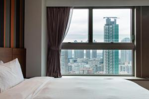 Giường trong phòng chung tại Le Prabelle Hotel