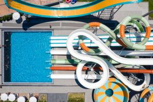 an overhead view of a pool at a water park at Kirman Calyptus Resort & SPA in Side