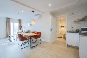 Kuchyň nebo kuchyňský kout v ubytování Apartamentos Magna Sevilla