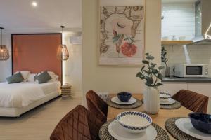 Postel nebo postele na pokoji v ubytování Apartamentos Magna Sevilla