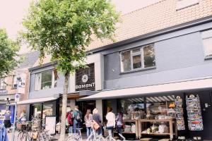 a group of people walking in front of a store at DBO81 Spacious apartment in the center and beach nearby in Domburg