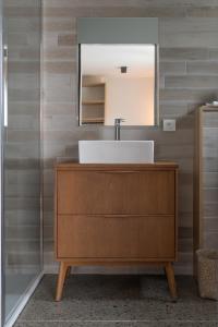 a bathroom with a sink and a mirror at Domaine Etxezahar in Bardos +60 photos