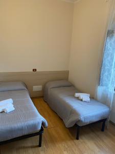 Posteľ alebo postele v izbe v ubytovaní La Foresteria