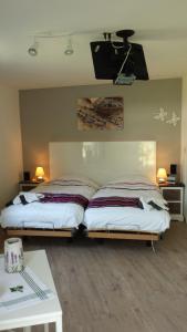 En eller flere senge i et værelse på De Witte Molen Kranenburg