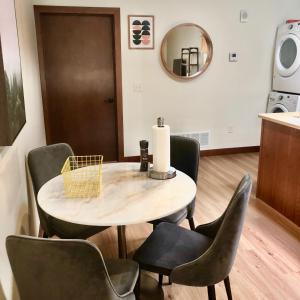 a dining room with a table and chairs at Your Downtown Rapid City Base Camp! in Rapid City