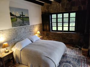Postel nebo postele na pokoji v ubytování Hacienda Hato Verde