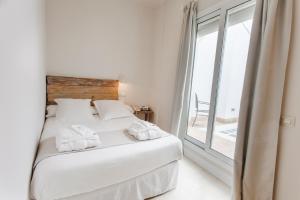 Łóżko lub łóżka w pokoju w obiekcie Hotel Boutique Elvira Plaza