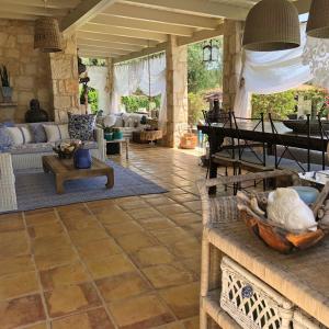 a living room with a couch and a table at Lalla Luxury Villa in Lithakia