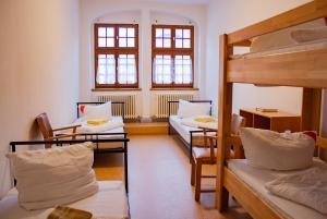 Postel nebo postele na pokoji v ubytování CVJM Peregrinus Herberge + 25 fotografií