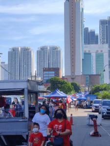 a group of people wearing face masks on a city street at Ksl D'Esplanade Studio Apartment's 2 in Johor Bahru