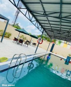 The swimming pool at or close to Ideal Home stay