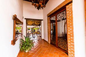 an entrance to a building with wrought iron doors at Bohemia Hotel Boutique in Mompos