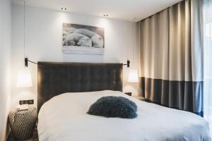 Postel nebo postele na pokoji v ubytování Hotel Les Mélèzes