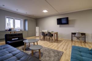 a living room with a couch and a table at Noclegi Stop and Sleep Zgorzelec in Zgorzelec