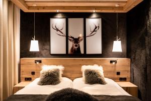 Postel nebo postele na pokoji v ubytování Hotel Les Mélèzes