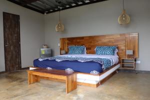 A bed or beds in a room at ADAMA BIOHOTEL