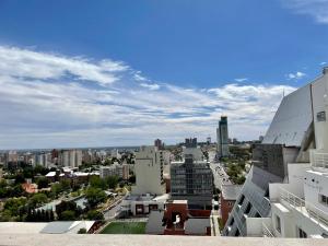 a view of a city from a building at Vistas del Sur - 13LV Departamento de dos dormitorios - Categoría Deluxe in Neuquén