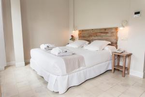 Łóżko lub łóżka w pokoju w obiekcie Hotel Boutique Elvira Plaza