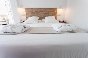Łóżko lub łóżka w pokoju w obiekcie Hotel Boutique Elvira Plaza