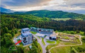 an aerial view of a resort in the mountains at MAIO Studio Silver Mountain Poiana Brasov in Poiana Brasov