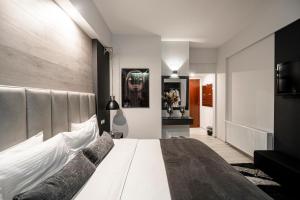 Postel nebo postele na pokoji v ubytování Lingos Hotel