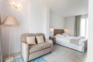 Łóżko lub łóżka w pokoju w obiekcie Hotel Boutique Elvira Plaza