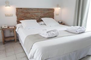 Łóżko lub łóżka w pokoju w obiekcie Hotel Boutique Elvira Plaza