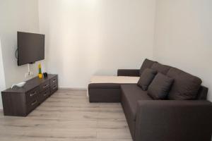 Televízia a/alebo spoločenská miestnosť v ubytovaní Ierapetra flats 2
