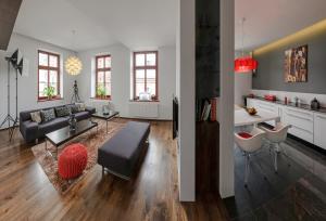 a living room with a couch and a table at Apartament ST1 in Cieszyn