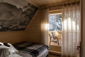 Łóżko lub łóżka w pokoju w obiekcie Tatra Chalet Krupówki 77A