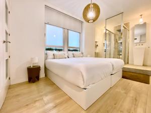 A bed or beds in a room at Charming La Casa de La Castellana