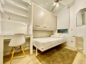A bed or beds in a room at Charming La Casa de La Castellana