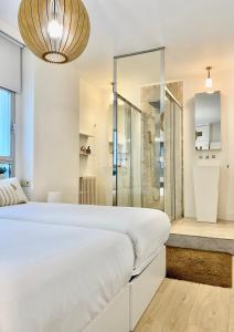 A bed or beds in a room at Charming La Casa de La Castellana