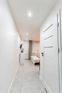 Łóżko lub łóżka w pokoju w obiekcie Apartament Jasnogórska
