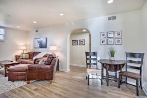 a living room with a couch and a table at Cozy Rapid City Retreat Perfect for Exploring! in Rapid City