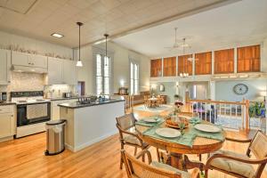 a kitchen and dining room with a table and chairs at Lisle Apt Fireplace and Stained Glass Windows! in Lisle